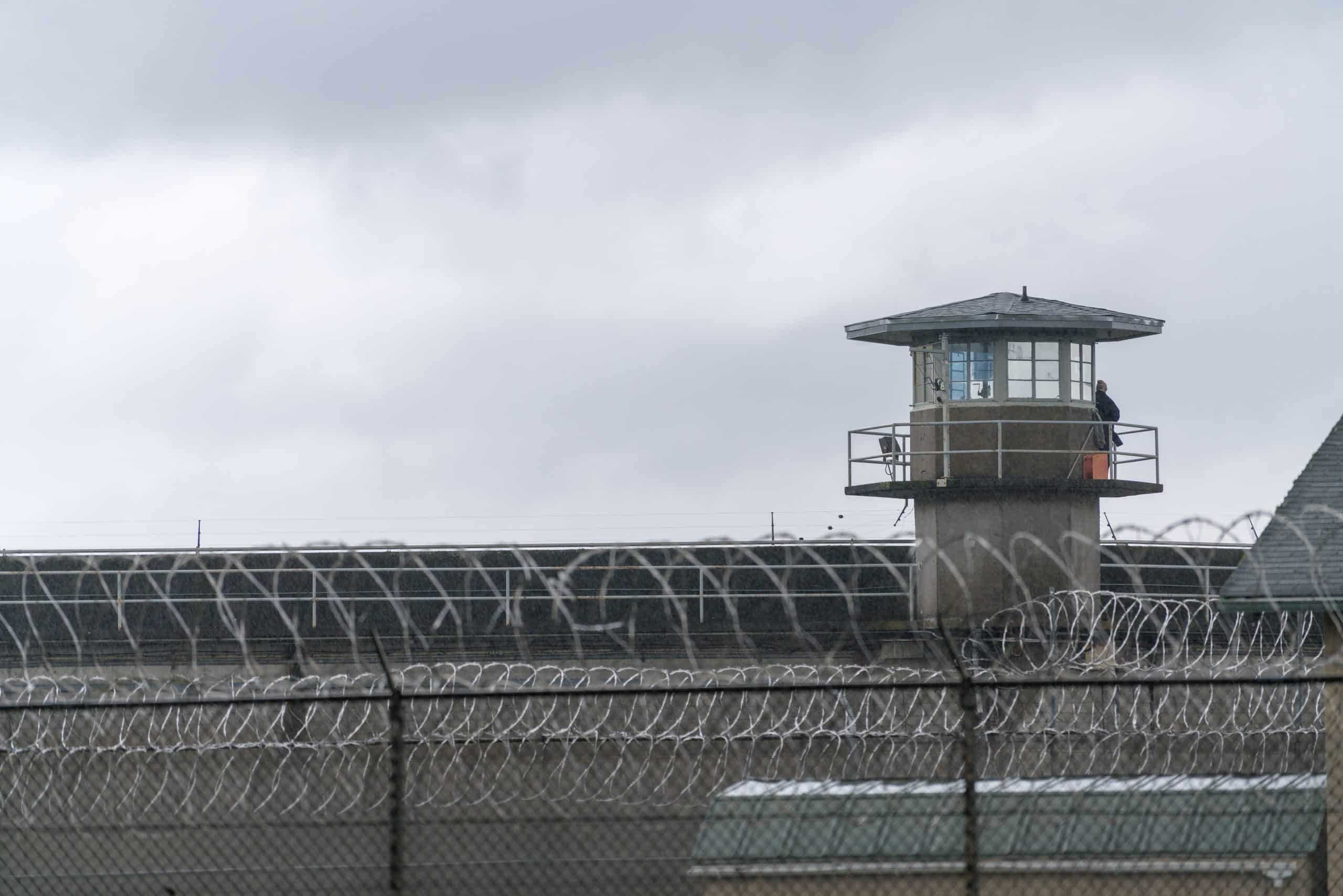 Correctional facility exterior with secure fence